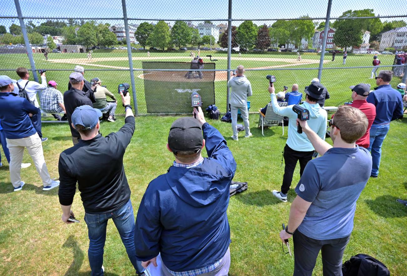 Scouts holding up radar guns