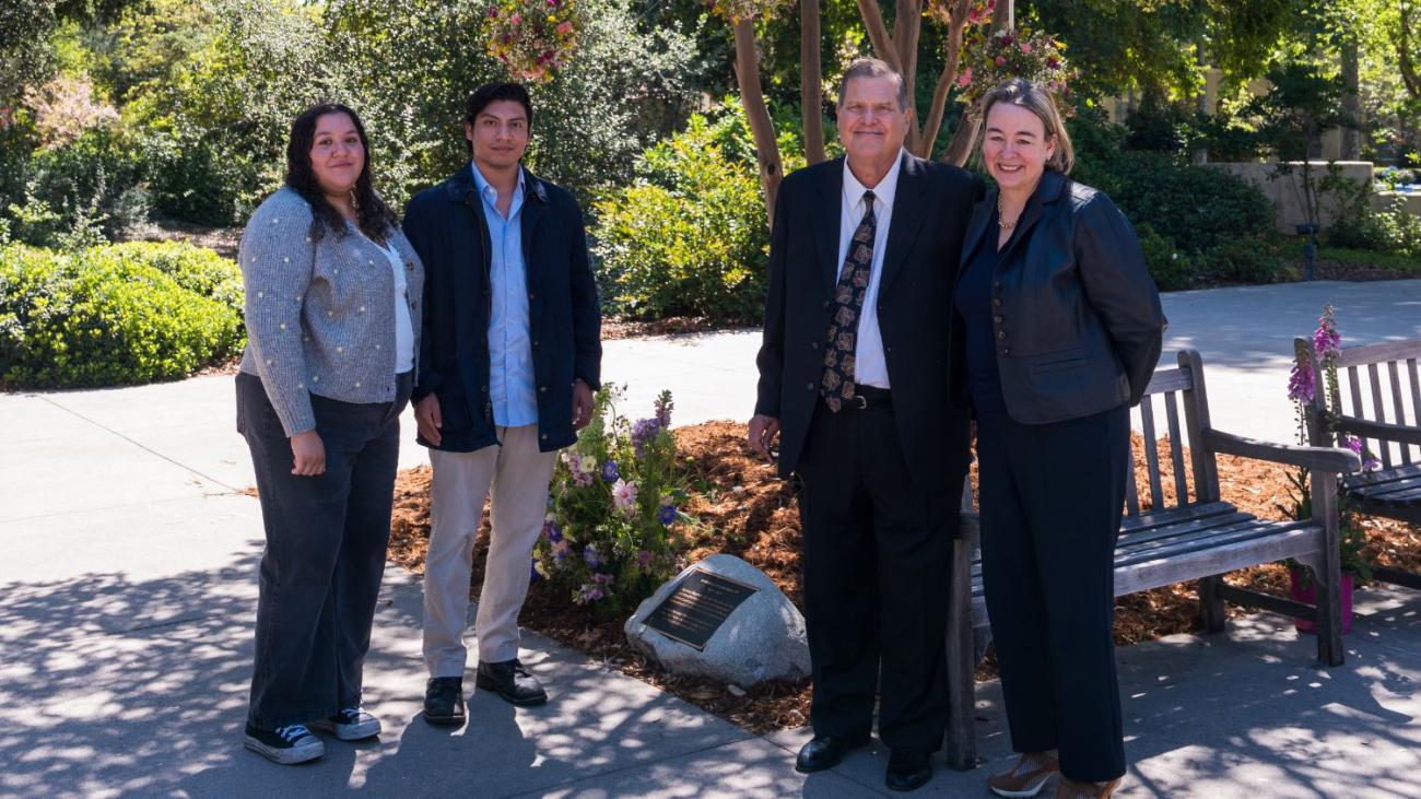 Linda Mazur's family in front of her bench and plaque with VP Maria Watson