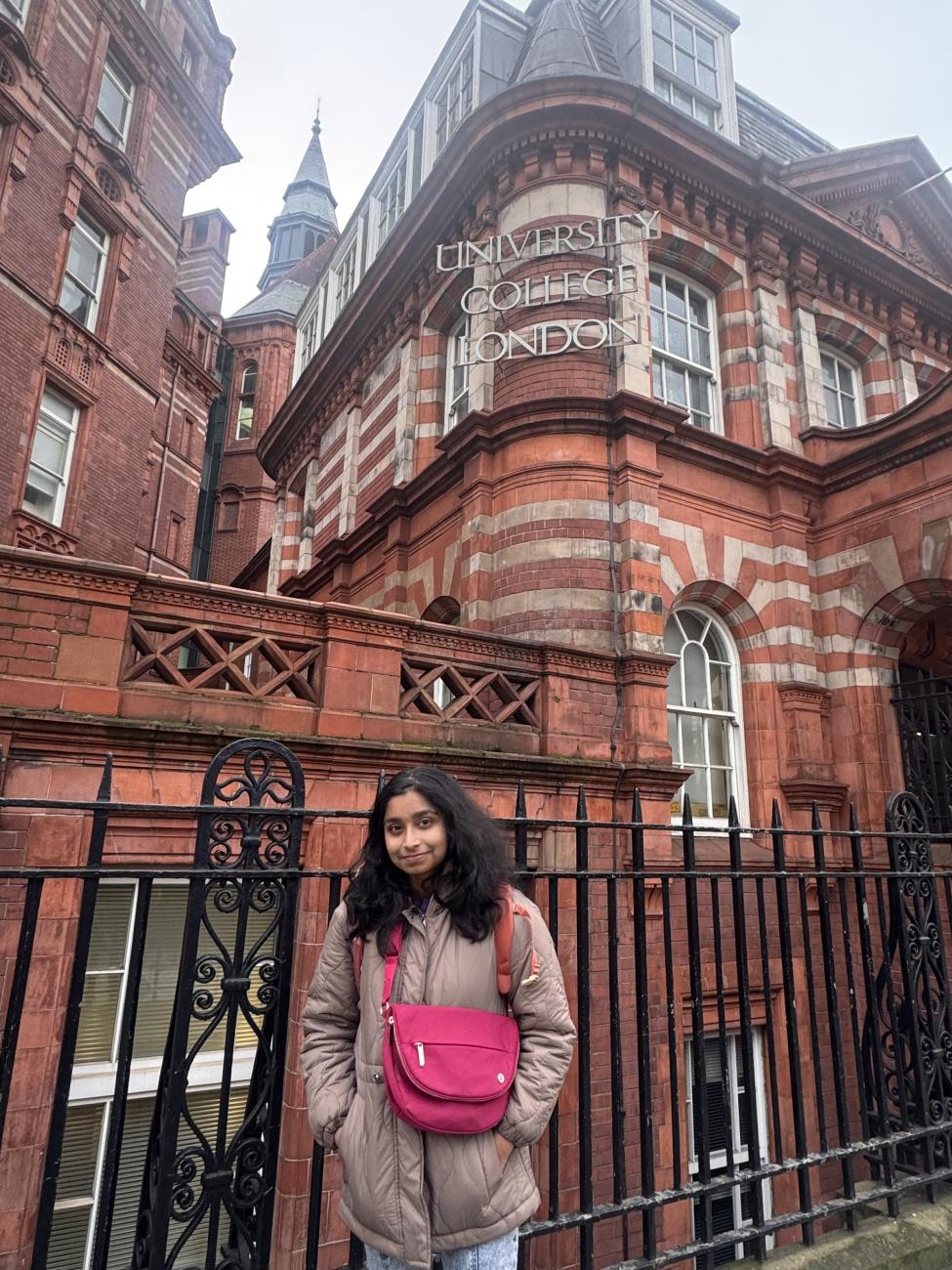 Student in front of building