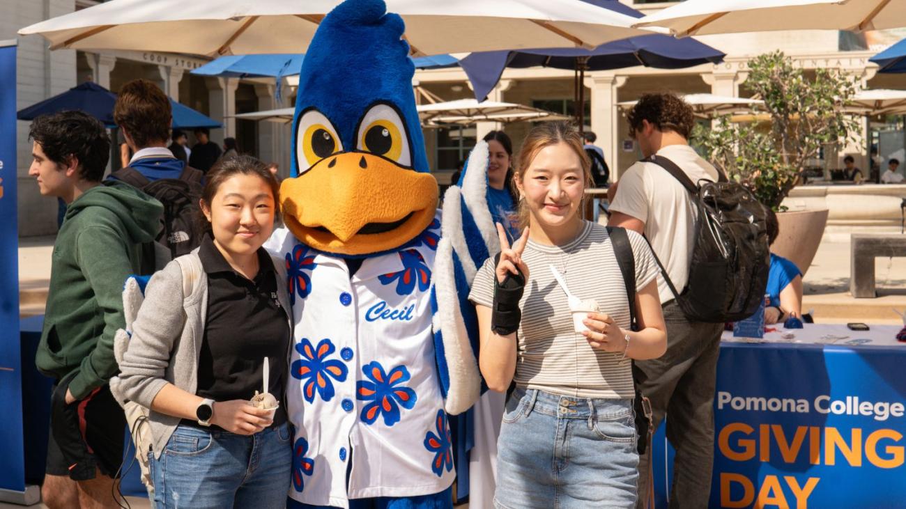 two students with cecil enjoying ice cream at giving day event