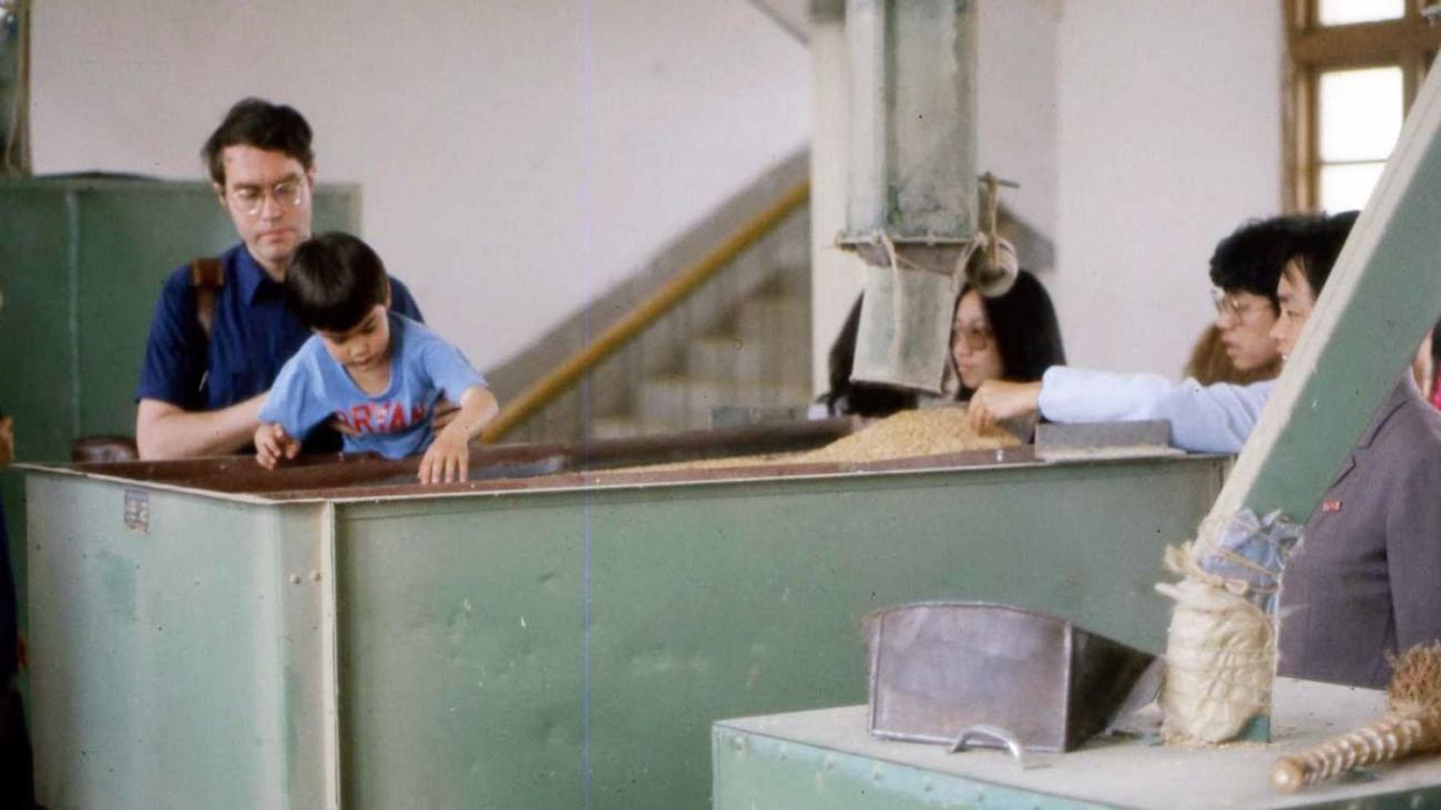 David Elliott and son, Bryan, touring a rice mill in 1981 in China