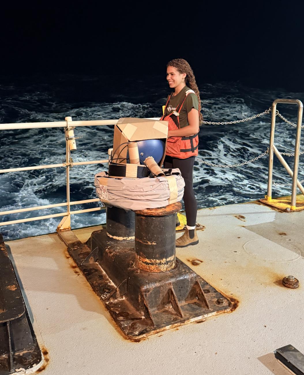 Hawthorne stands on deck of ship with drifter equipment.