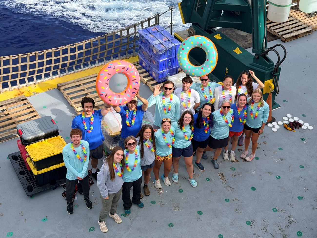 Group photo with all members of research teams gathered on deck