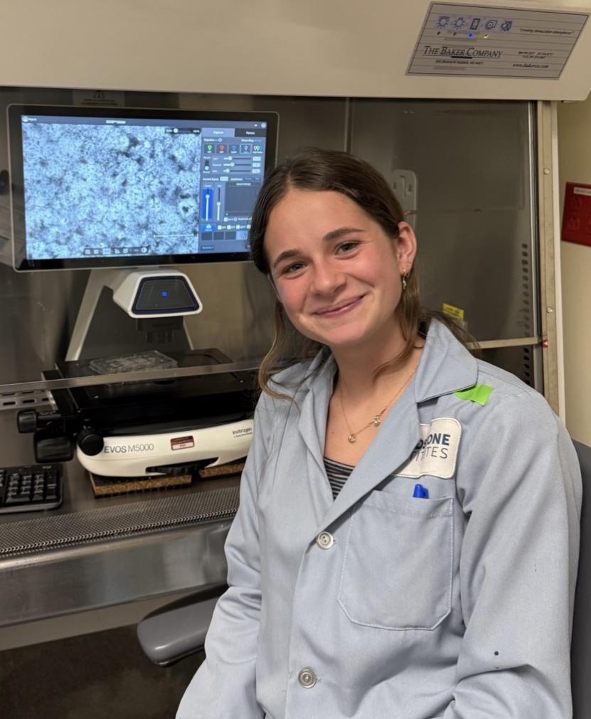Mirabelle Pit sits in a developmental cardiology lab.