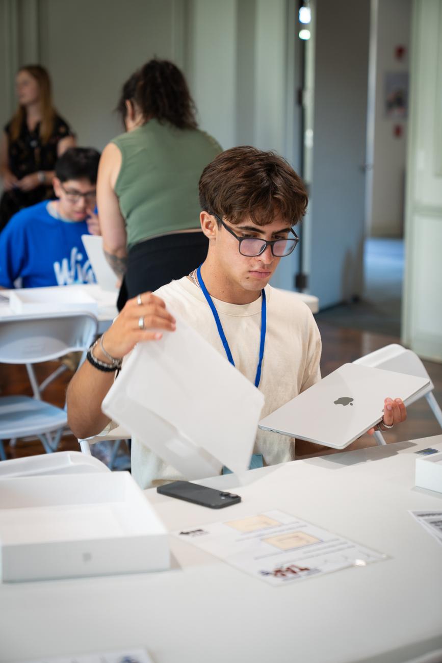 A student gets set up with his new laptop.