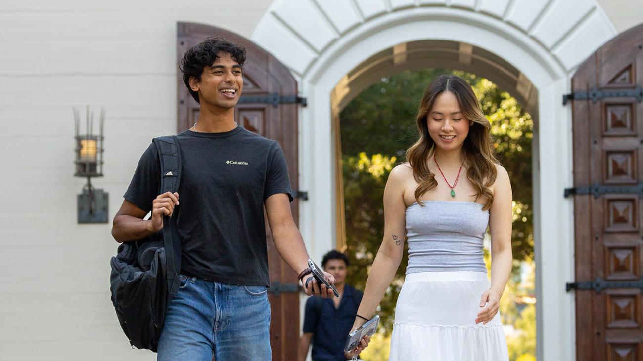 Students walking through doorway