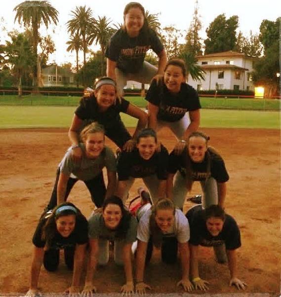 A group of women make a human pyramid