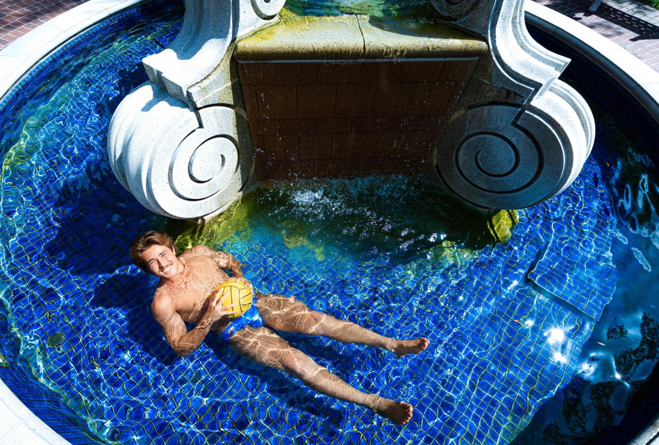 A man sitting in a fountain