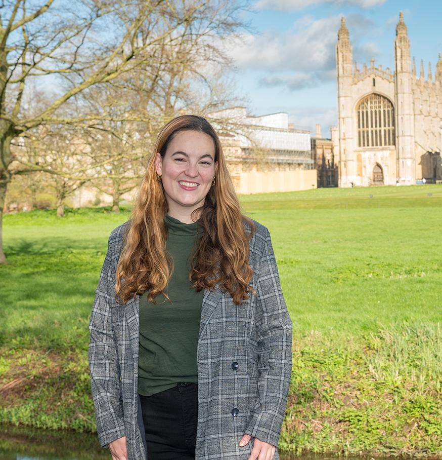 Sofia Dartnell stands outside in Cambridge, England, with King's Chapel in the background.