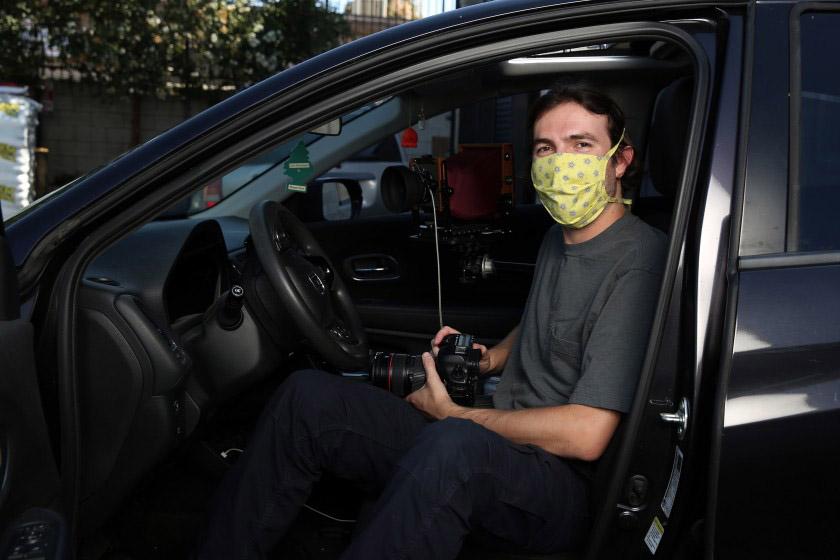 Photographer Ian Byers-Gamber in his Honda, the vehicle that frames portraits he’s shot during the pandemic.(Dania Maxwell / Los Angeles Times)