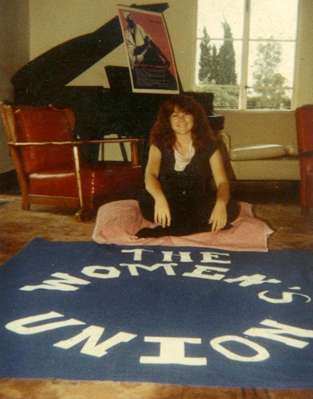 Colleen O'Neil with Women's Union banner