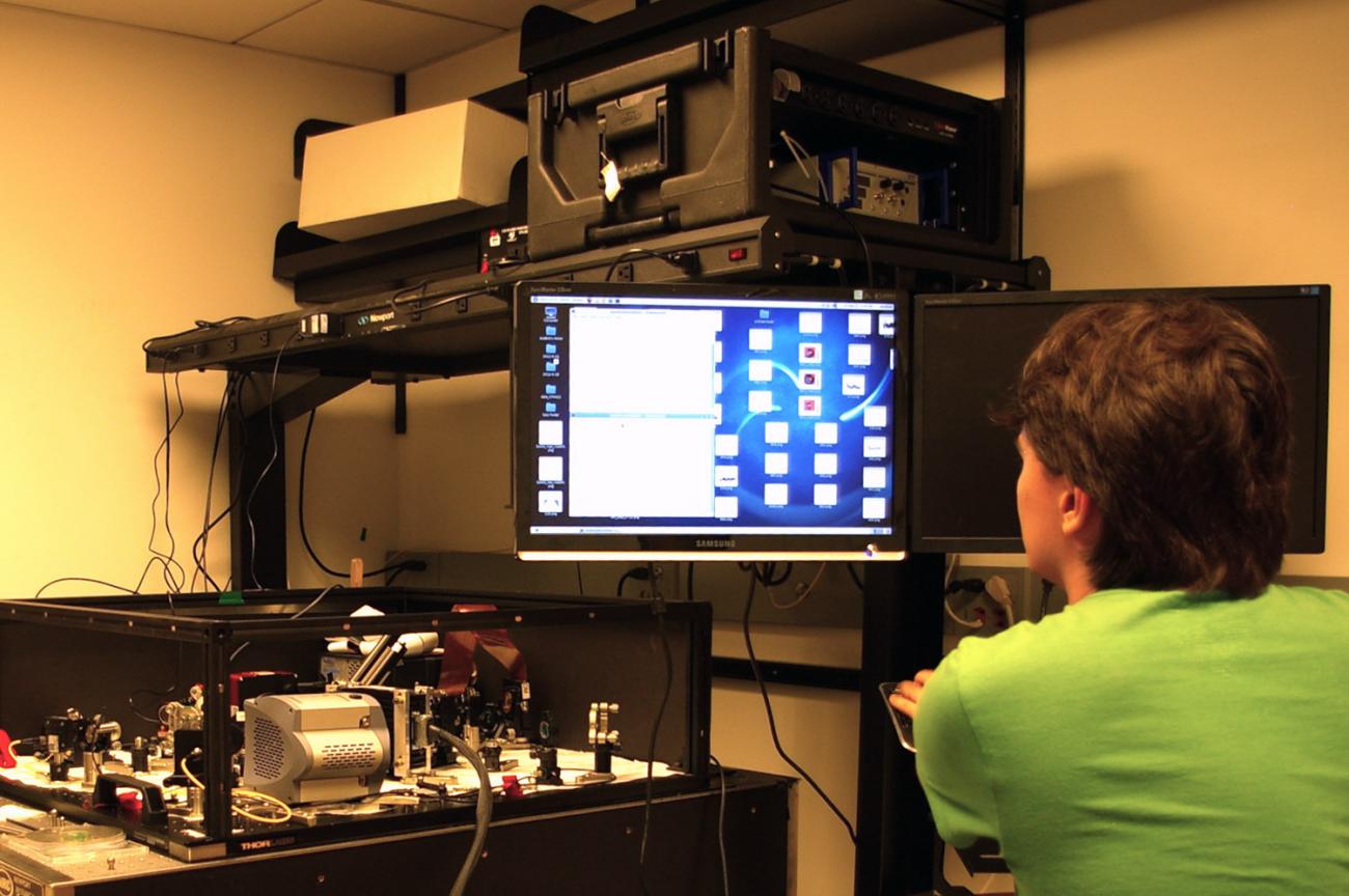 Daniel Contreras ’13 sits at the control computer in the Adaptive Optics lab