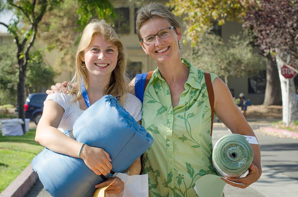 A parent helps her daughter move in on the first day at Pomona College.
