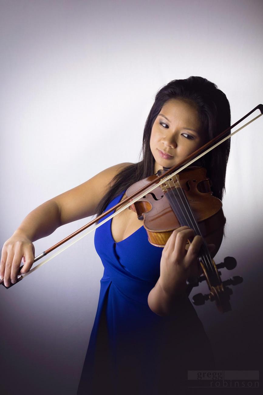 Alumna Caroline Fernandez plays the violin,