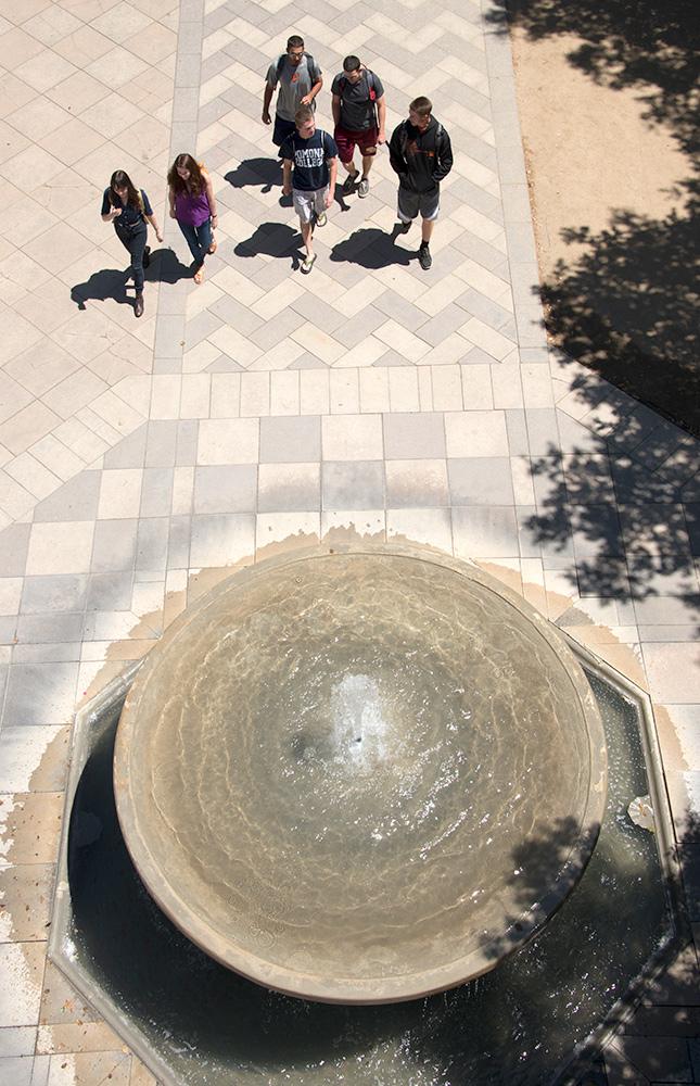 Students walking near Bixby Fountain on North Campus at Pomona College.