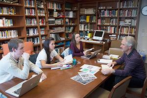 students talking with a professor