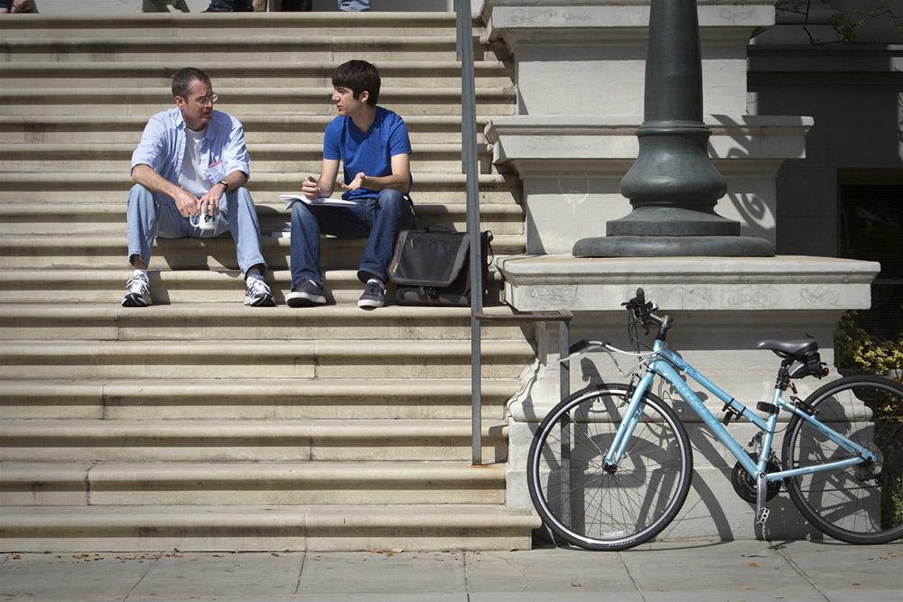 Professor David Menifee-Libey and a student on the Carnegie Hall steps