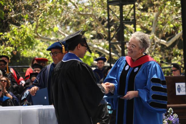 President G. Gabrielle Starr congratulates one of the members of the graduating Class of 2023.