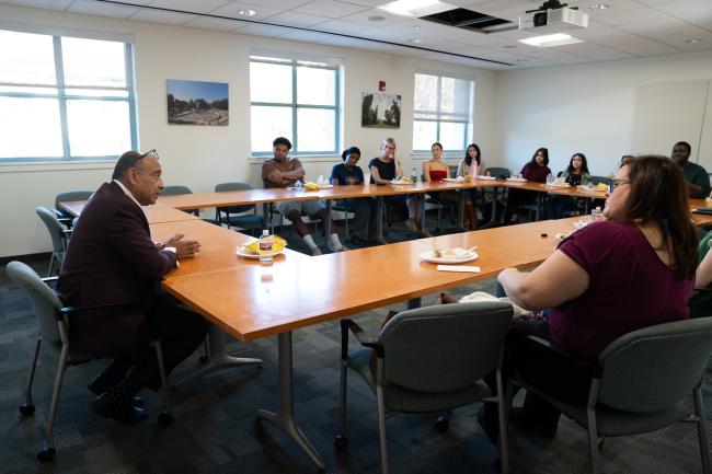 A group of people sitting around a table