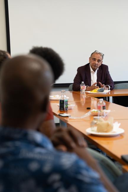 A man talks to students