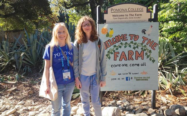 A family in front of a sign