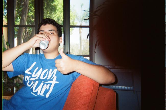 A student drinks a soda
