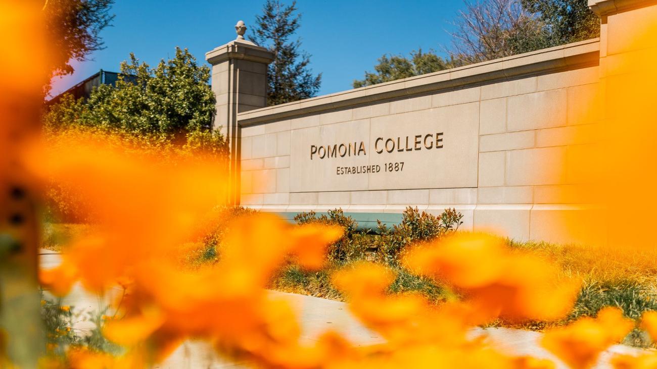 Pomona College sign and flowers blooming