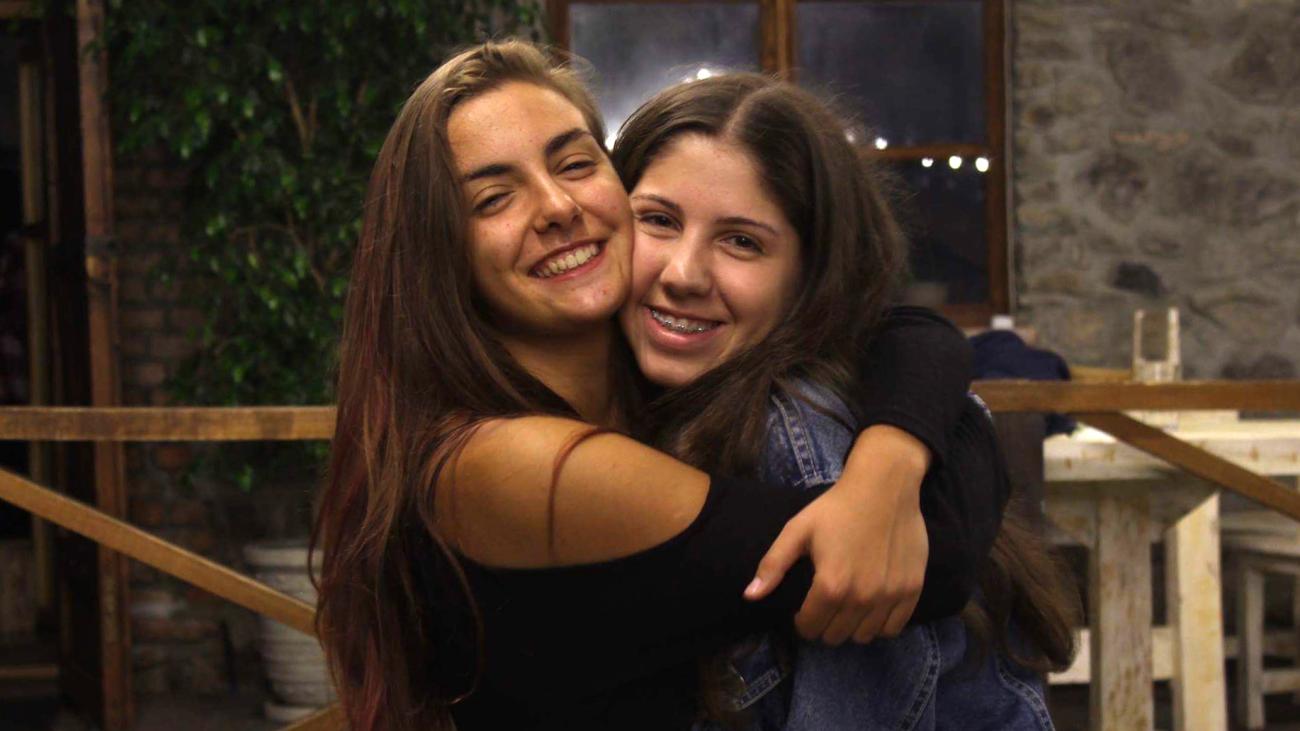 Elena Vedevello '23 (left) based her novel "Yellow Flowers" on the experiences of her friend Anano (left)