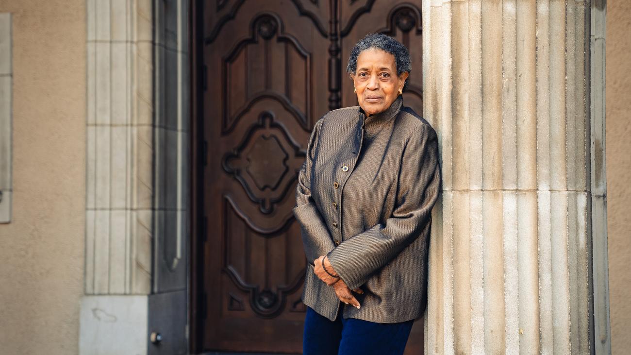 Myrlie Evers Williams, class of 1968, standing in front of Little Bridges in 2022