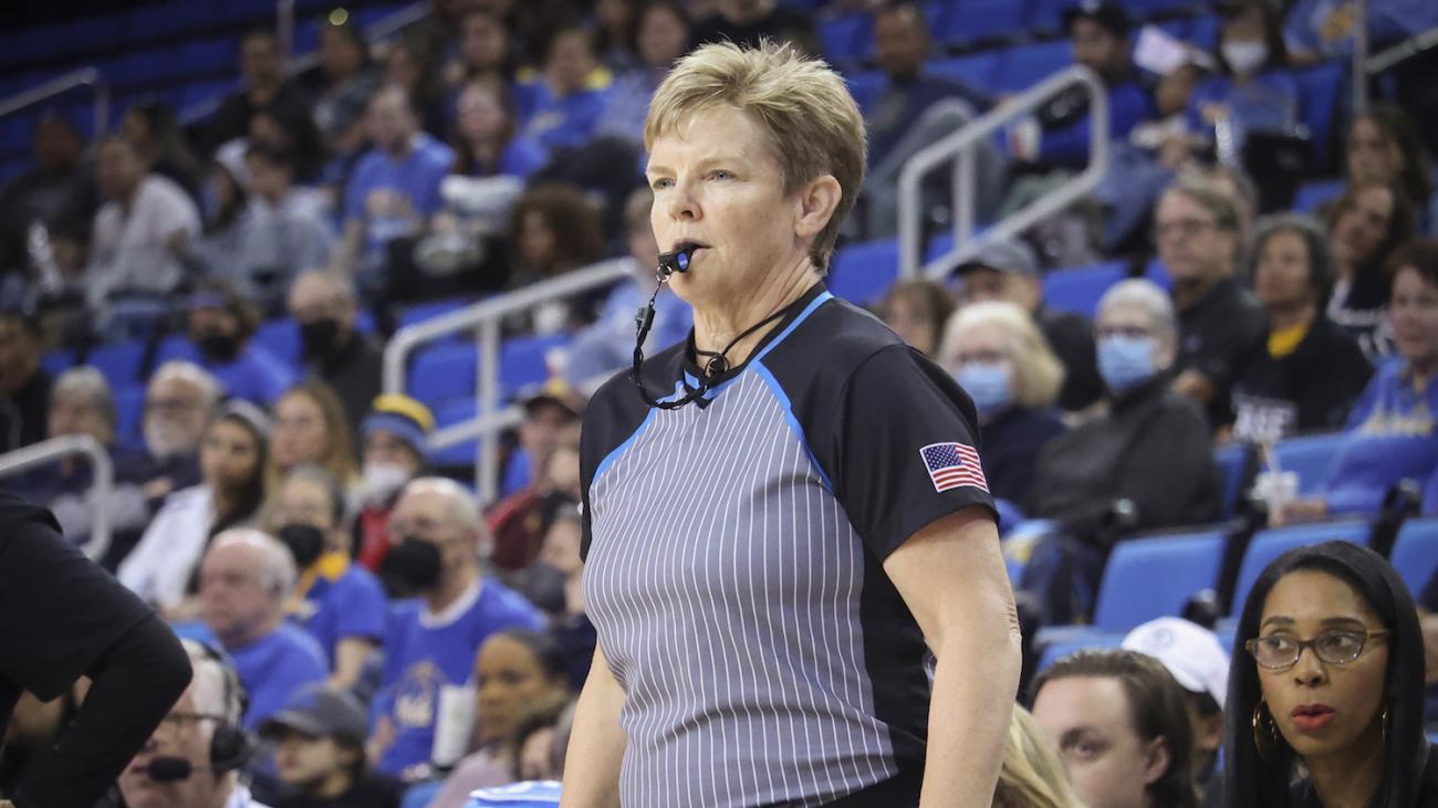 Referee Melissa Barlow '87 with whistle