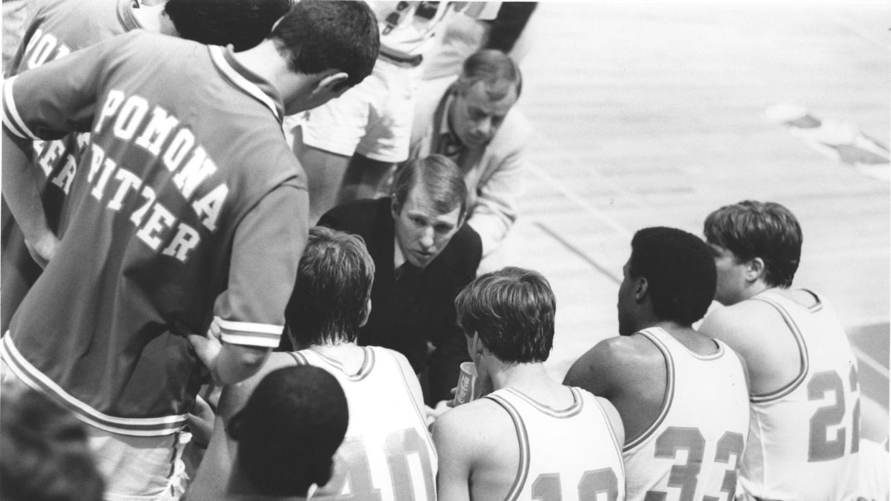 Coach Gregg Popovich in Pomona-Pitzer huddle