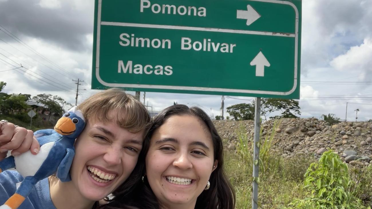 two students with Cecil in front of Pomona sign