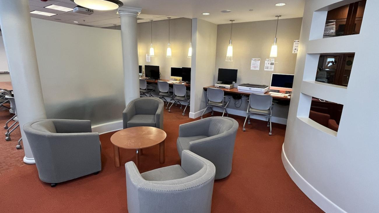 middle section of the FLRC showing chairs around a desk and computers along the backwall