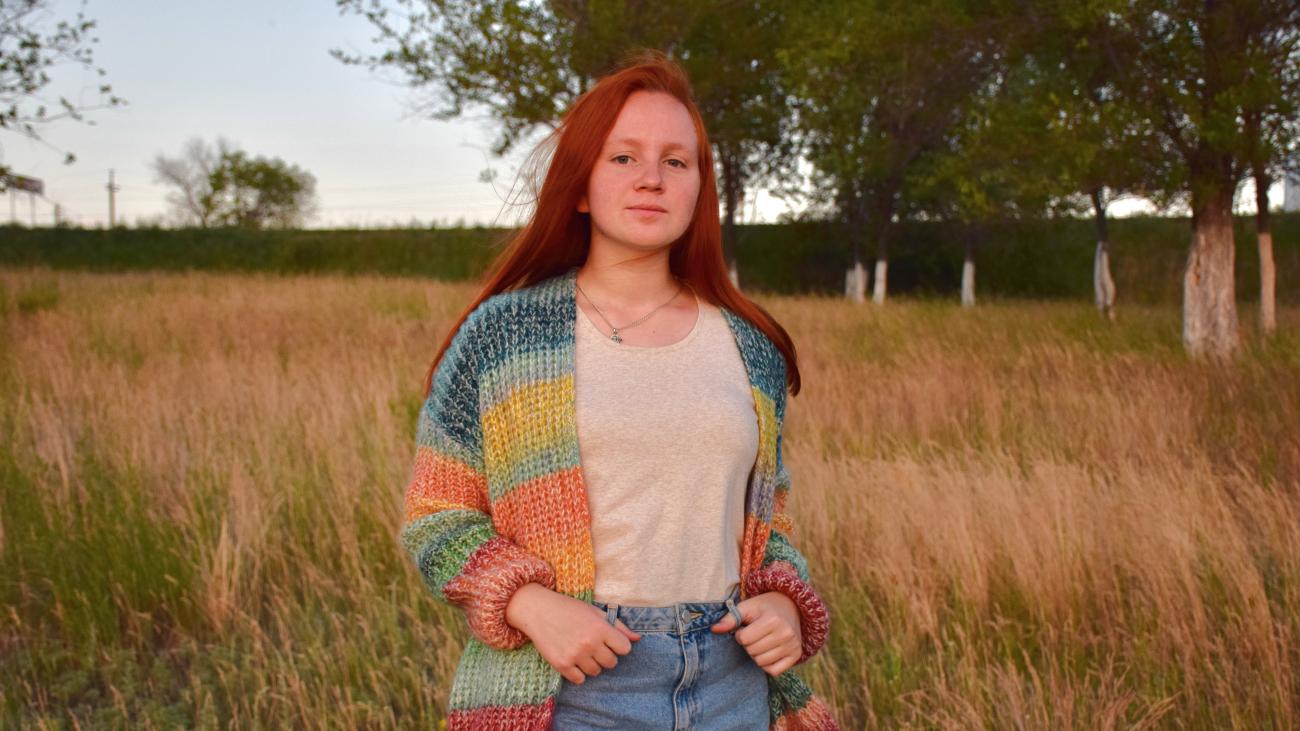 Russian Language Resident standing in a field