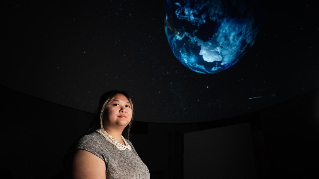 Kendra Nguyen '24 inside the Pomona Planetarium.