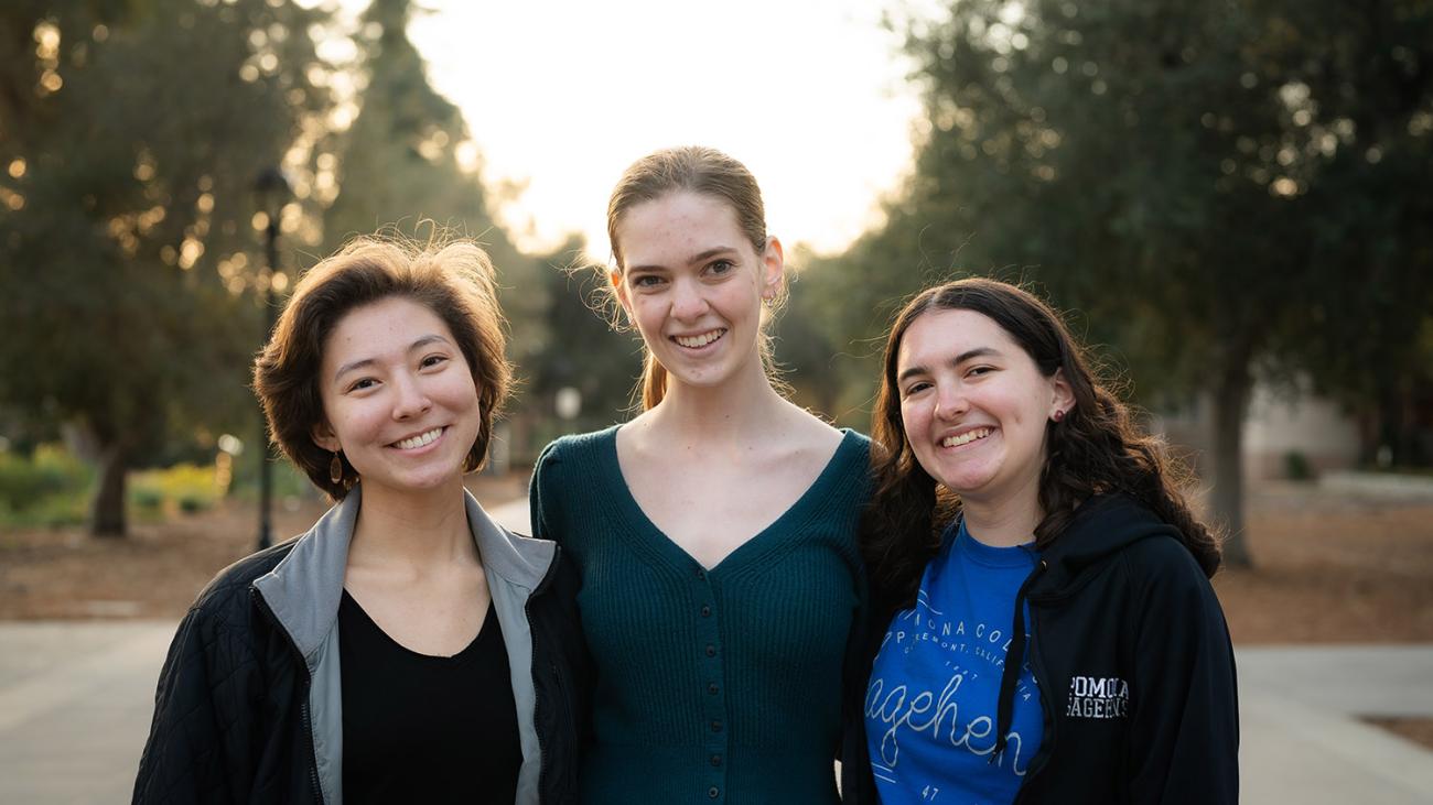 Three students pose for a photo on Stover Walk 