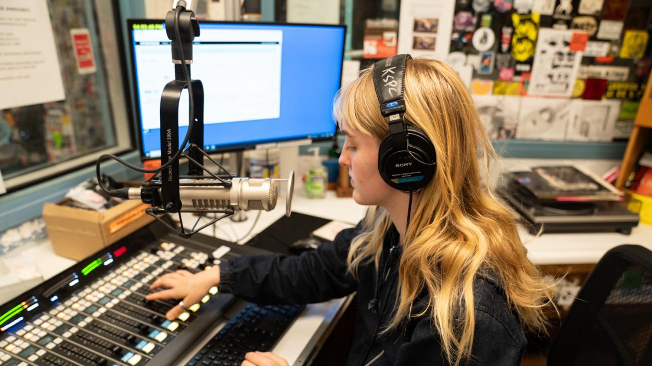 Lottie Malkmus '27 at a radio soundboard