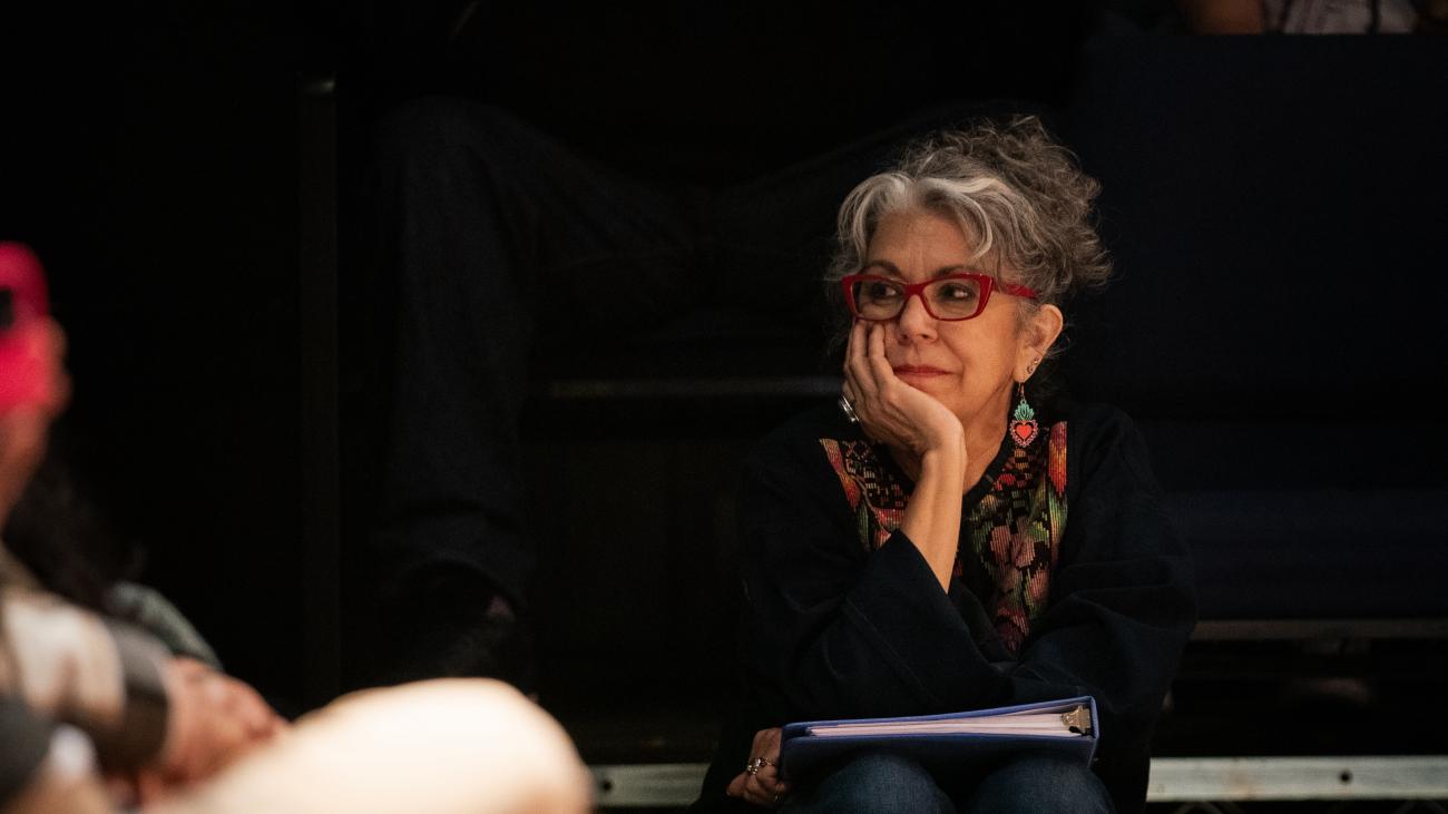 Rose Portillo '75 sits on a bench