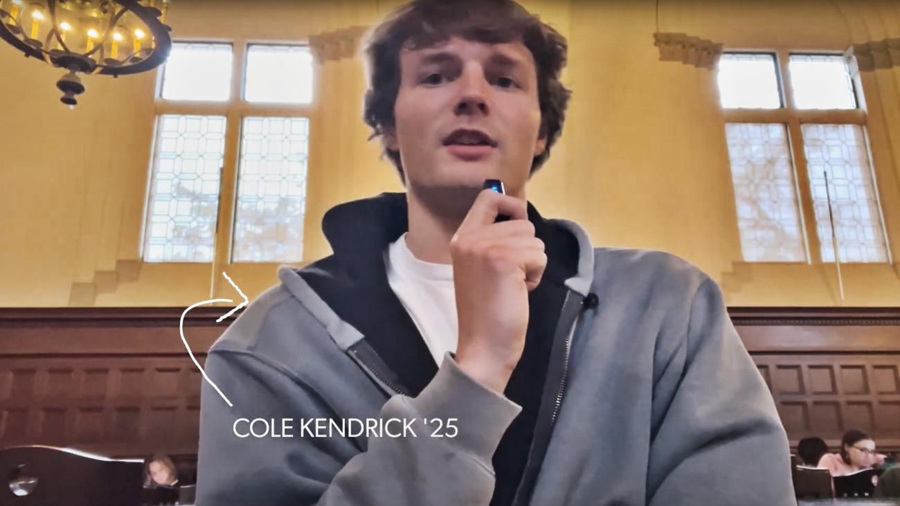 Cole Kendrick looking at the camera and talking into a little microphone