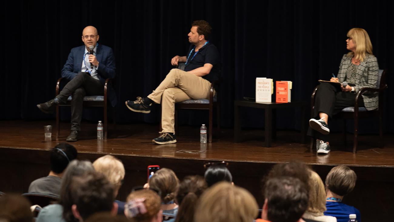 Daniel Ziblatt, Corey Brettschneider and Amanda Hollis-Brusky seated on stage in Rose Hills Theater at Pomona College