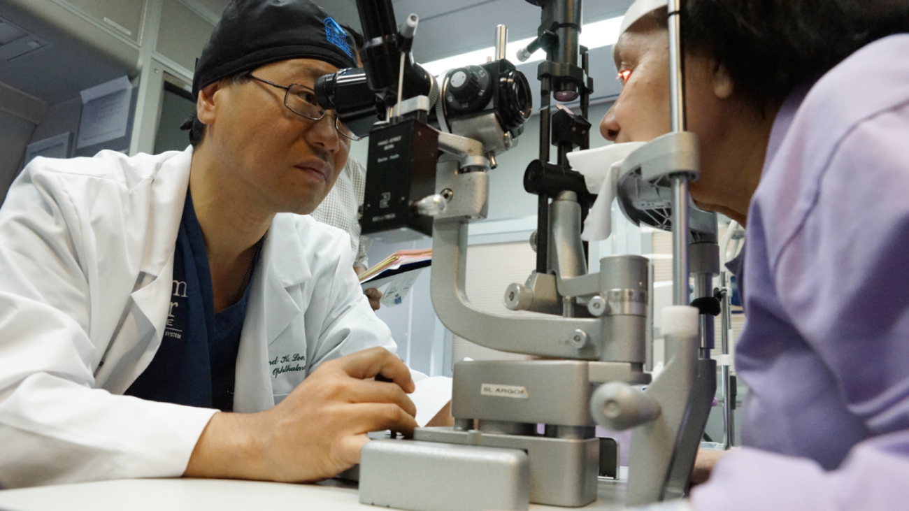 Richard Lee providing eye care to patient