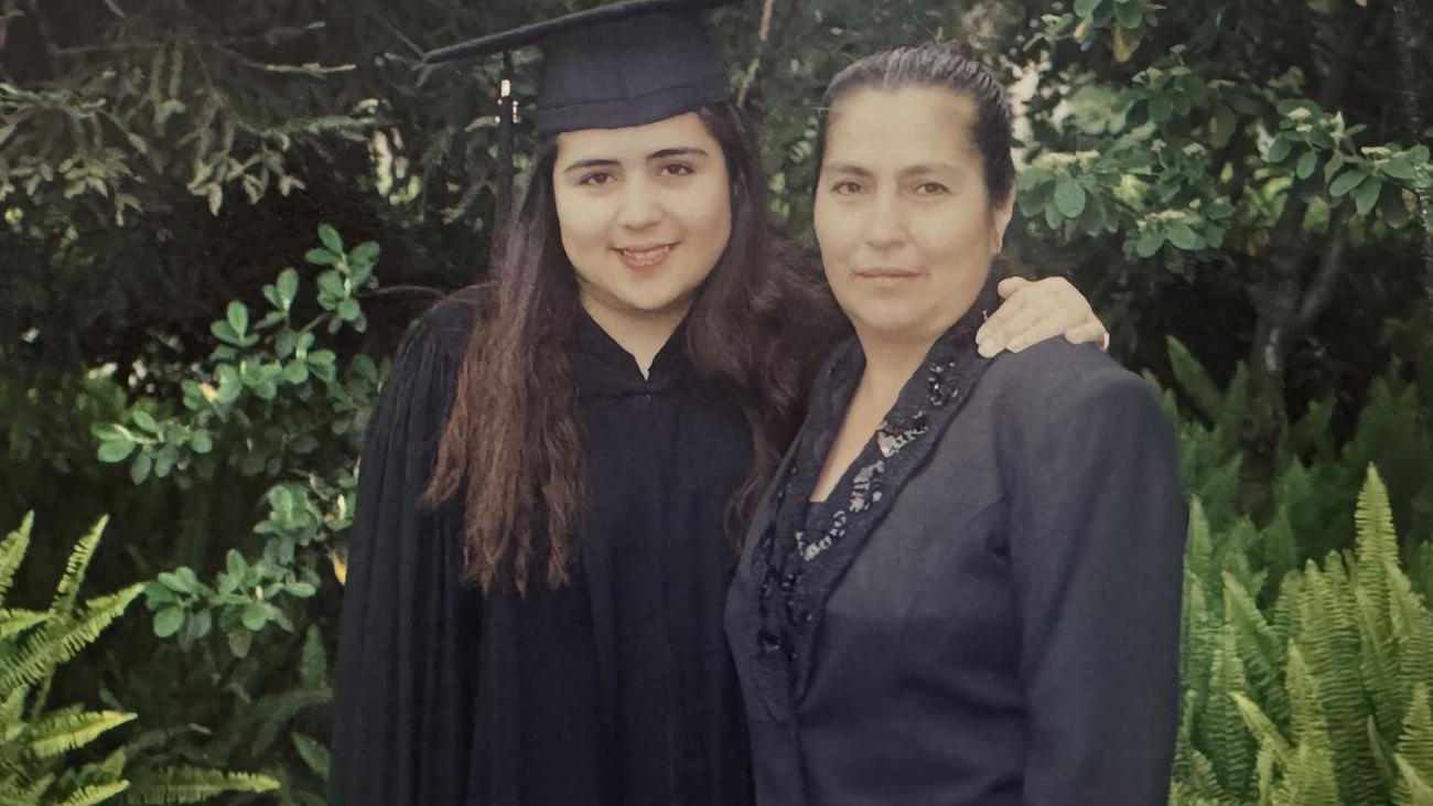 Mireya Jimenez at her Pomona College graduation posing with her mother