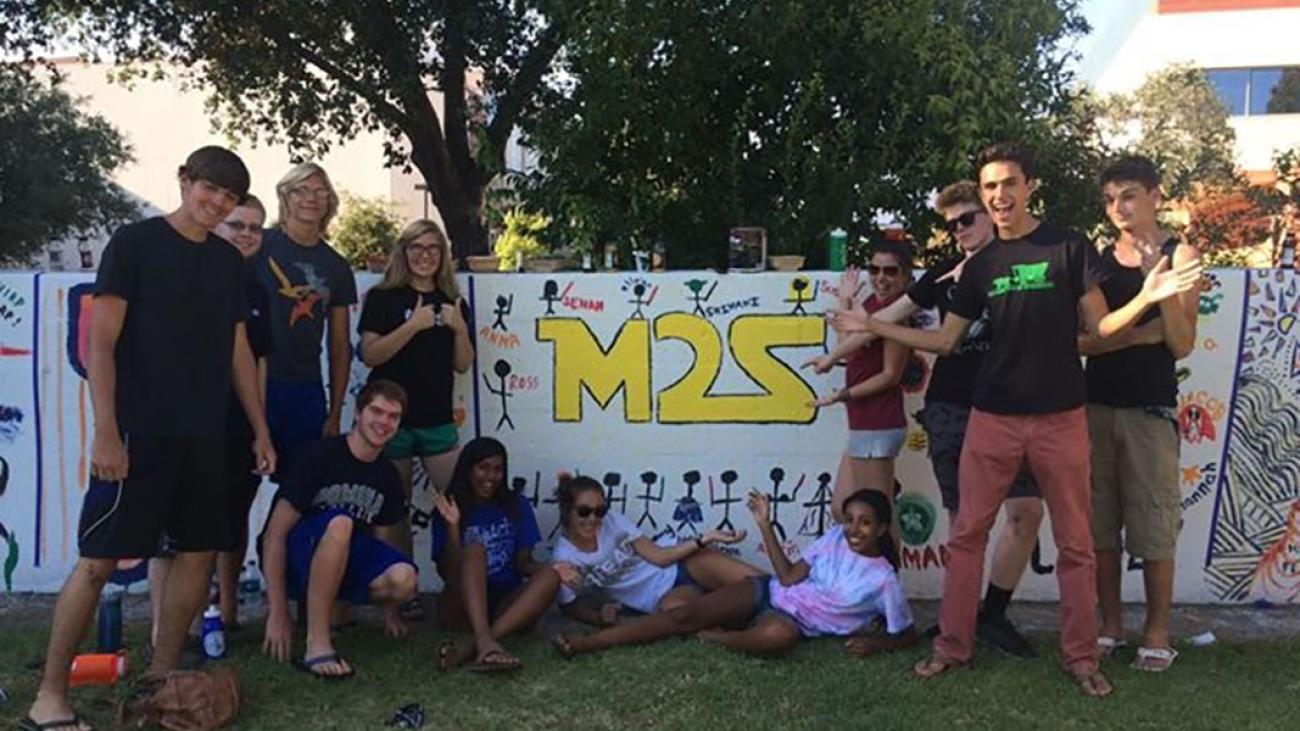 Simons and 5C friends pose as a sponsor group