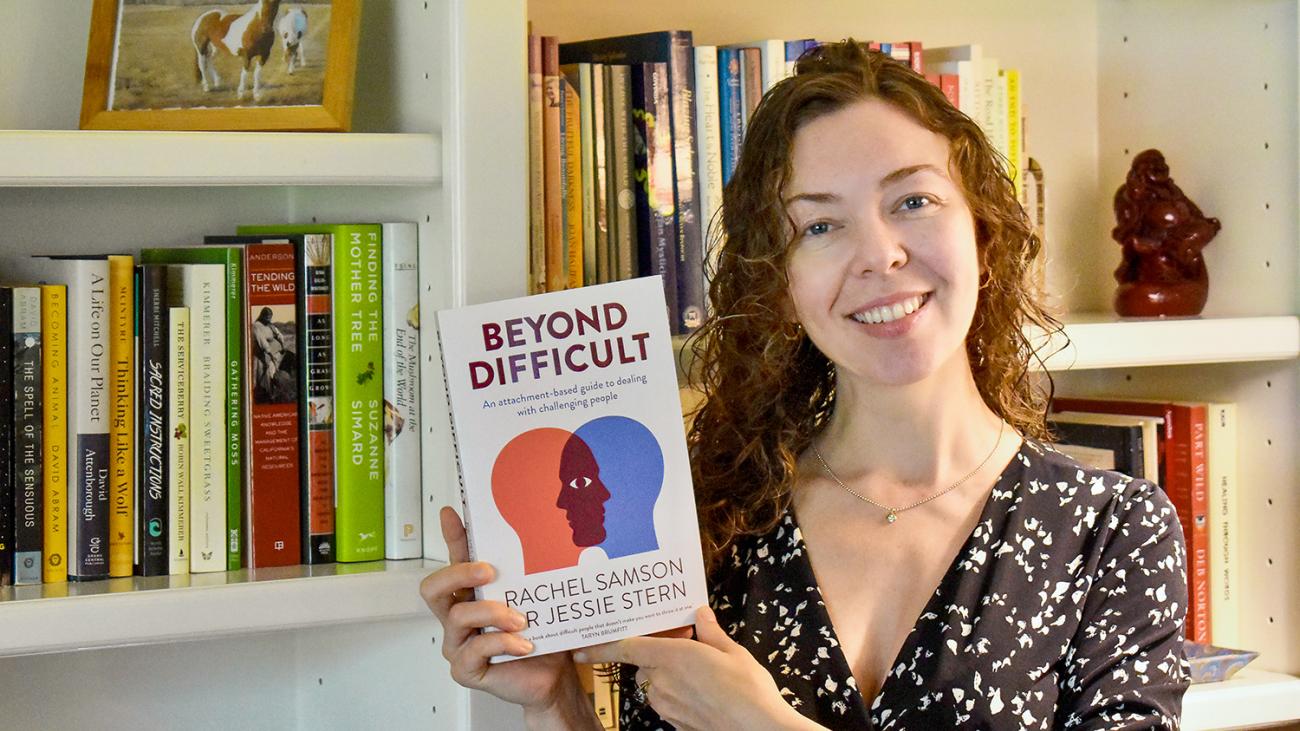 Prof. Jessica Stern holding her book Beyond Difficult