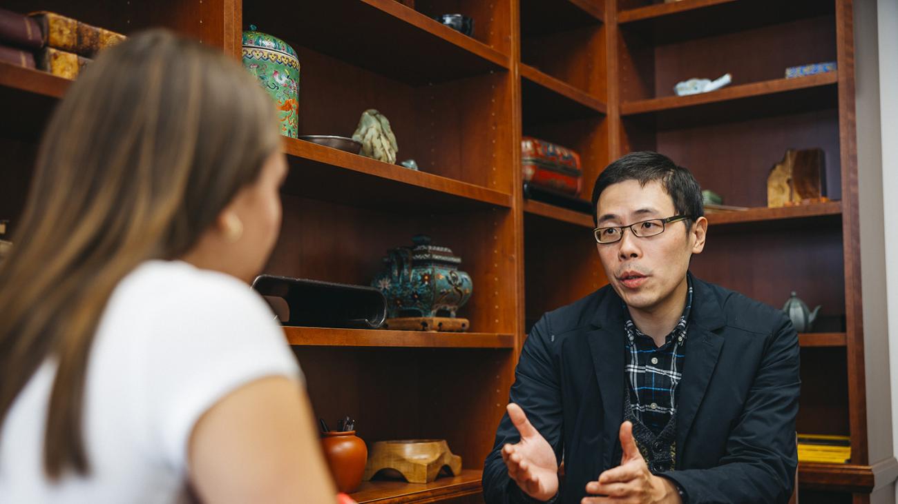 Professor Feng Xiao and student