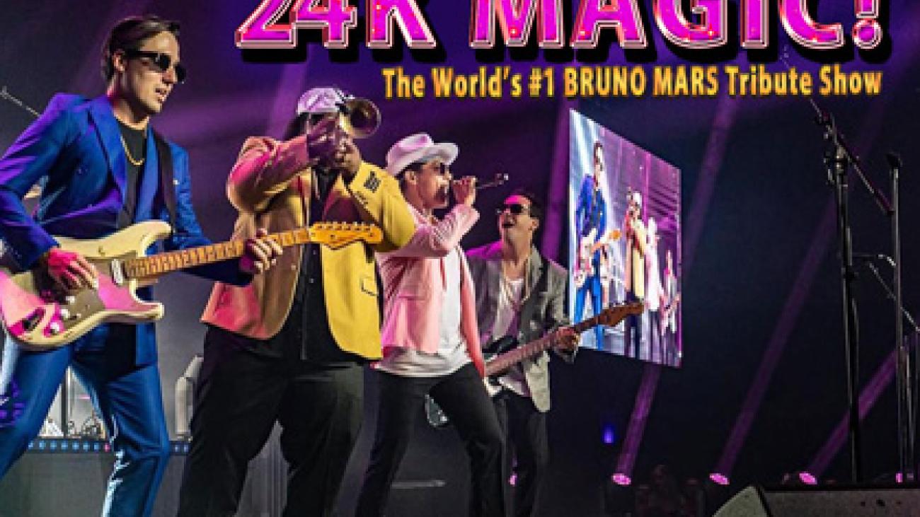 [text] 24K Magic! The world's #1 Bruno Mars tribute show. Action shot of the band perfoming in a line from the side of the stage.