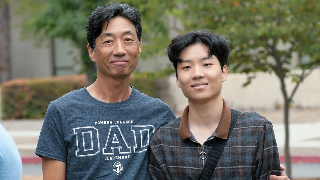 Pomona father with arm around son on student move-in day.
