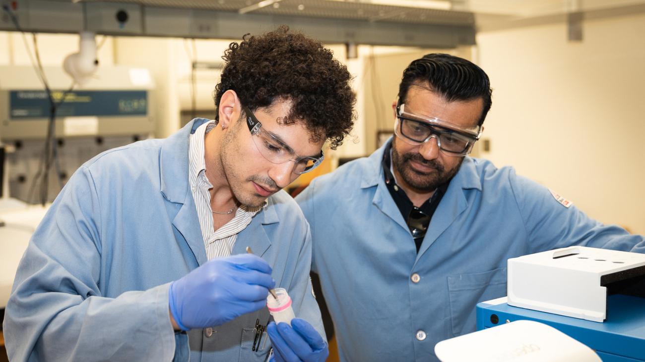 Student in lab with Professor Malkiat Johal