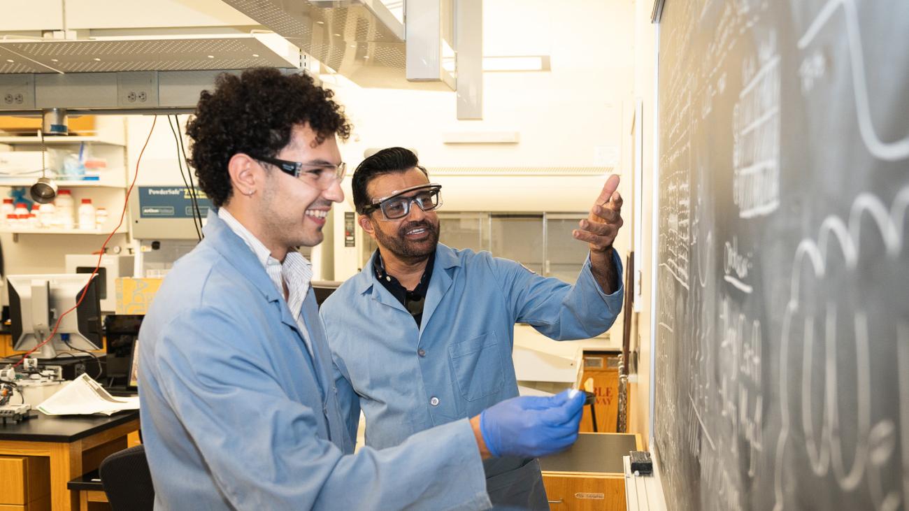 Student in lab with Professor Malkiat Johal