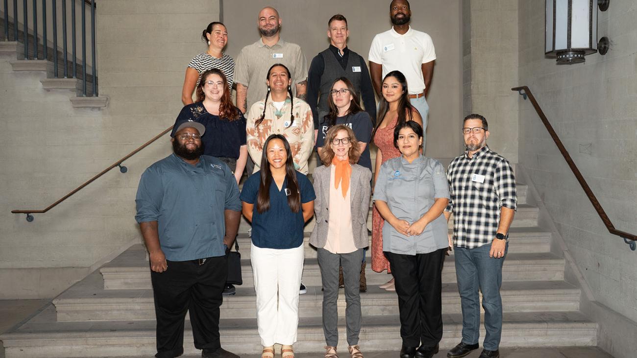 Staff Council members pose for a photo on steps